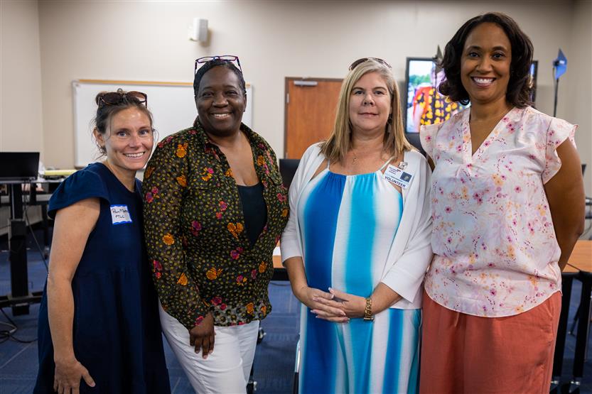 Four members making up the PTO leadership board smile